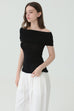 Noir off-shoulder knit in black