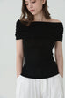 Noir off-shoulder knit in black